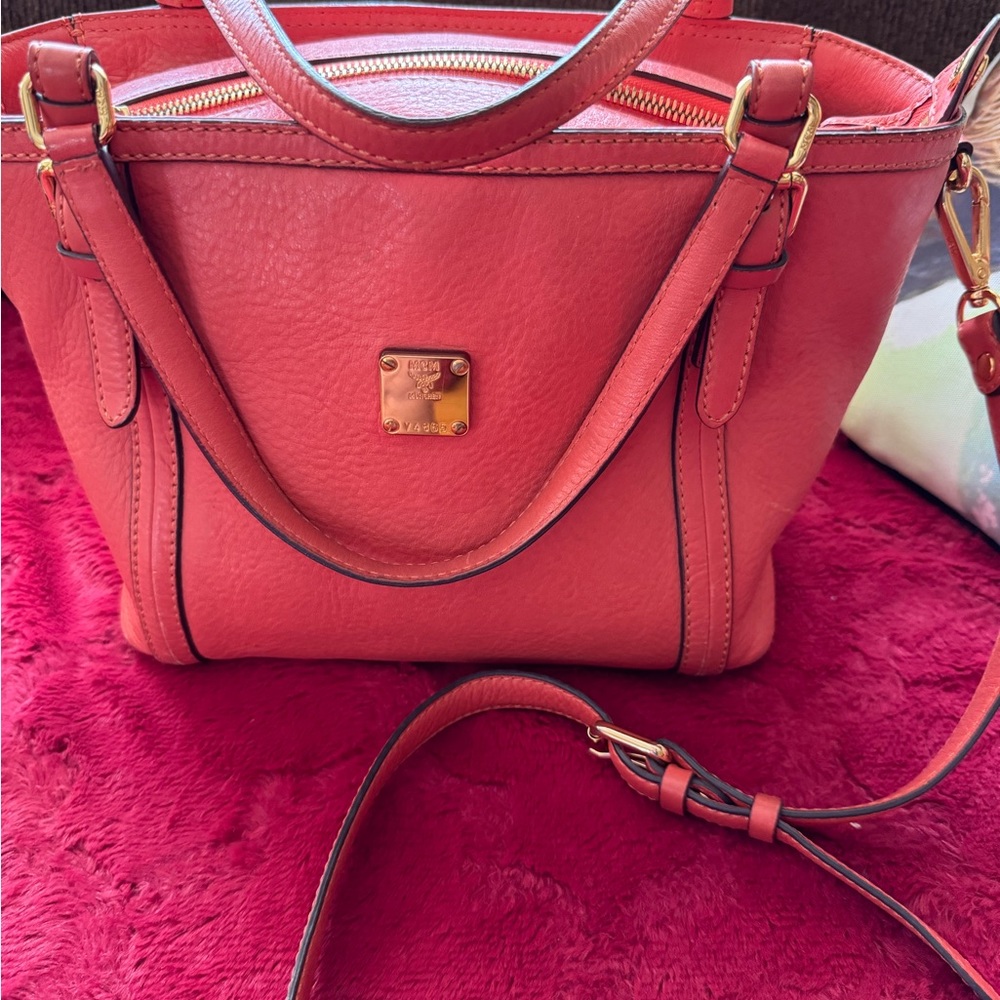 MCM 2 way bag! Some wear on corners. Clean inside and out 10 by 8 orange color